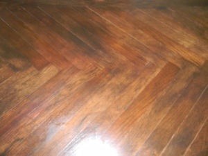 The Hickory top in a herringbone pattern is distressed, stained, glazed and sealed.